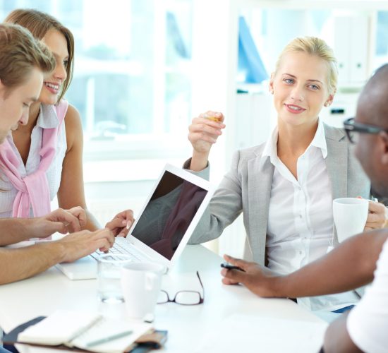 Group of friendly businesspeople having meeting